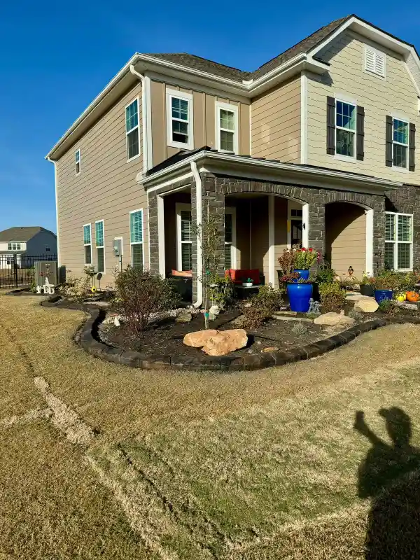 Beautifully completed decorative landscape curbing around a garden bed at a Central New York home